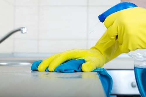 Staff following cleaning safety instructions and controls